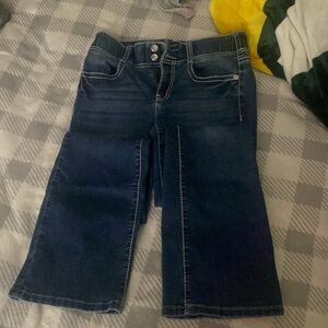 Bootcut woman’s jeans with gems on the back